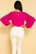 Blusa de manga larga fucsia con lazo delantero