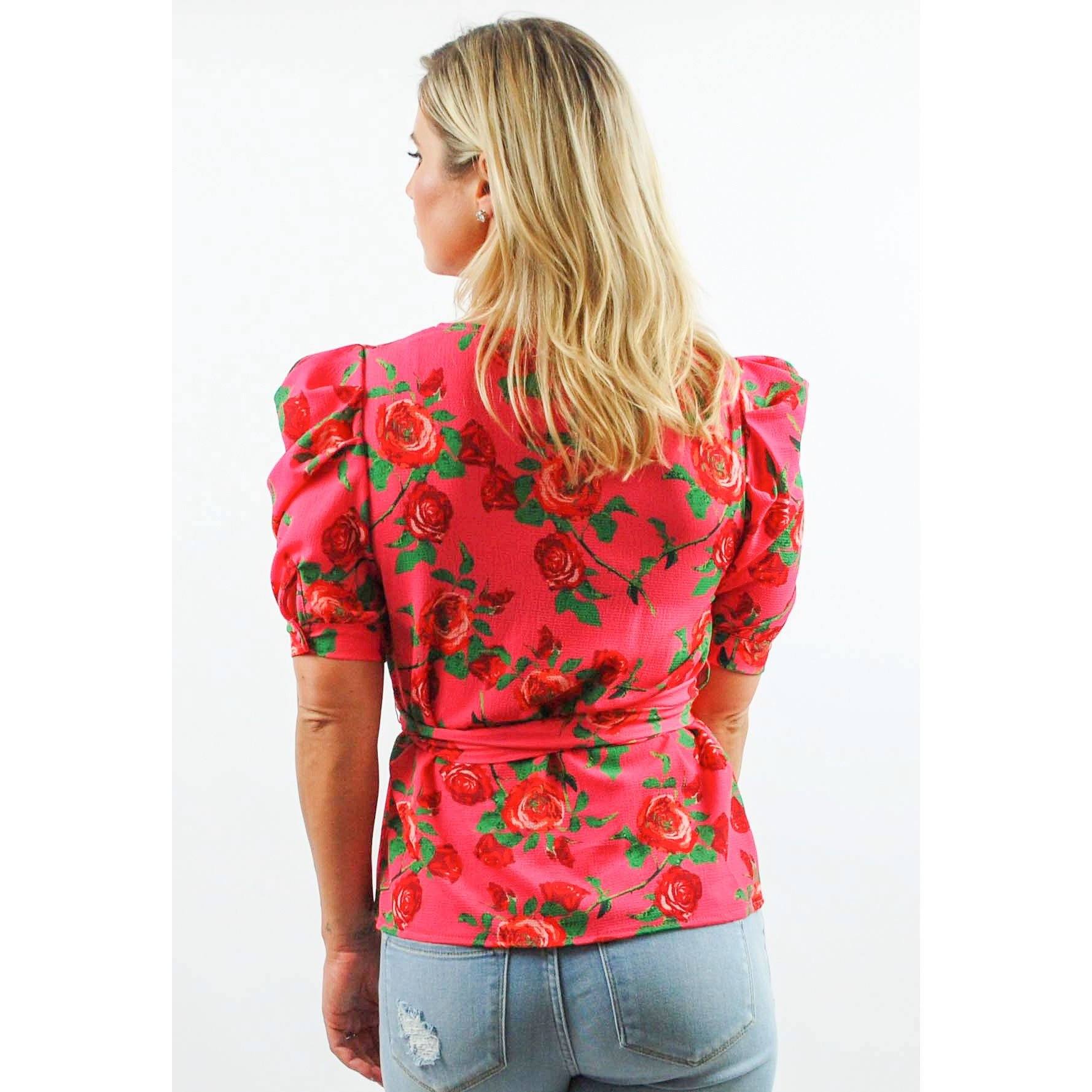 Blusa envolvente de manga abullonada con estampado floral en rosa