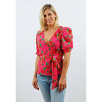 Blusa envolvente de manga abullonada con estampado floral en rosa