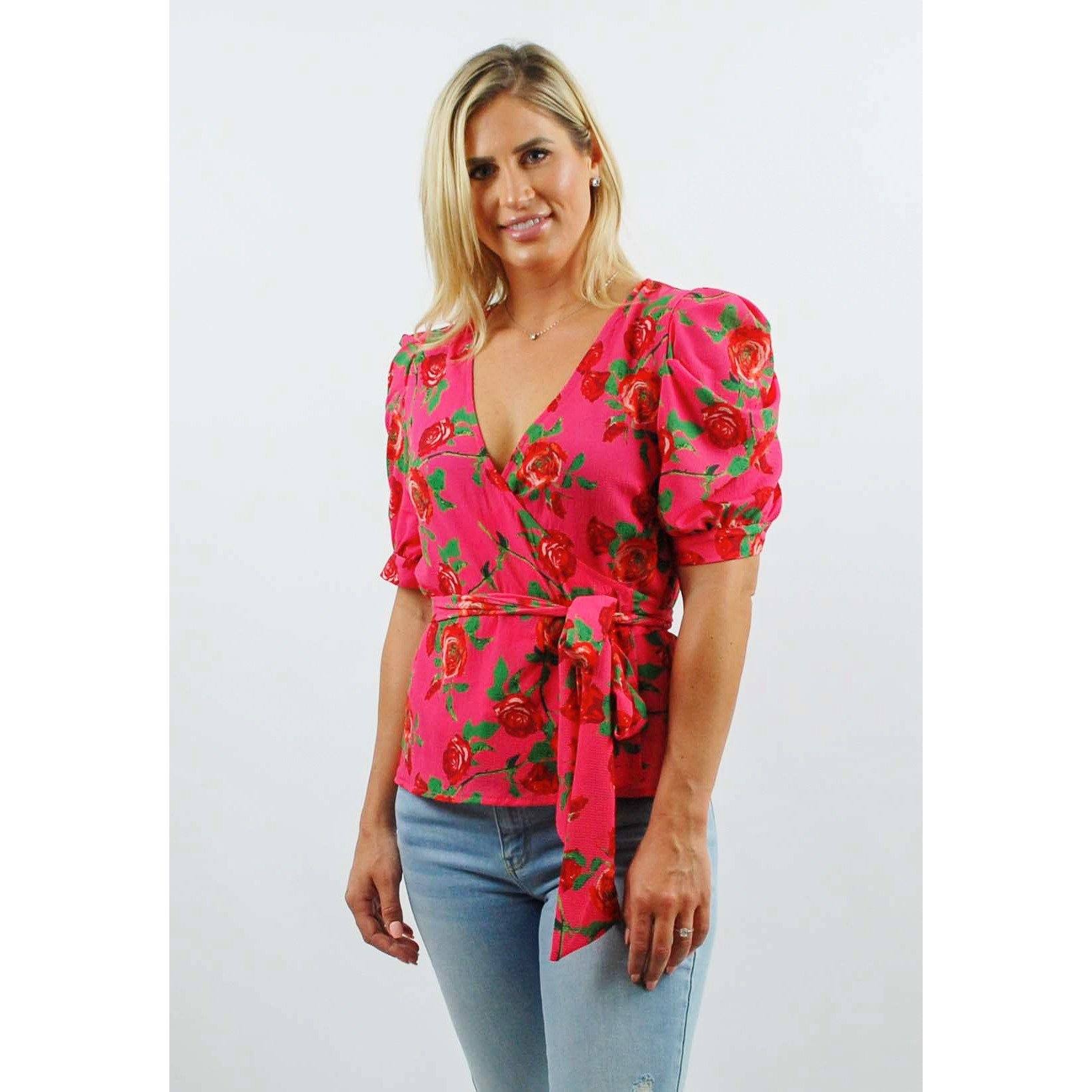 Blusa envolvente de manga abullonada con estampado floral en rosa