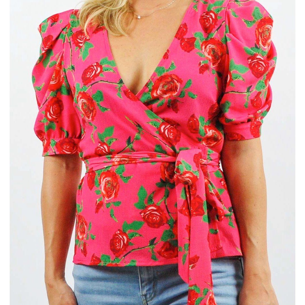 Blusa envolvente de manga abullonada con estampado floral en rosa