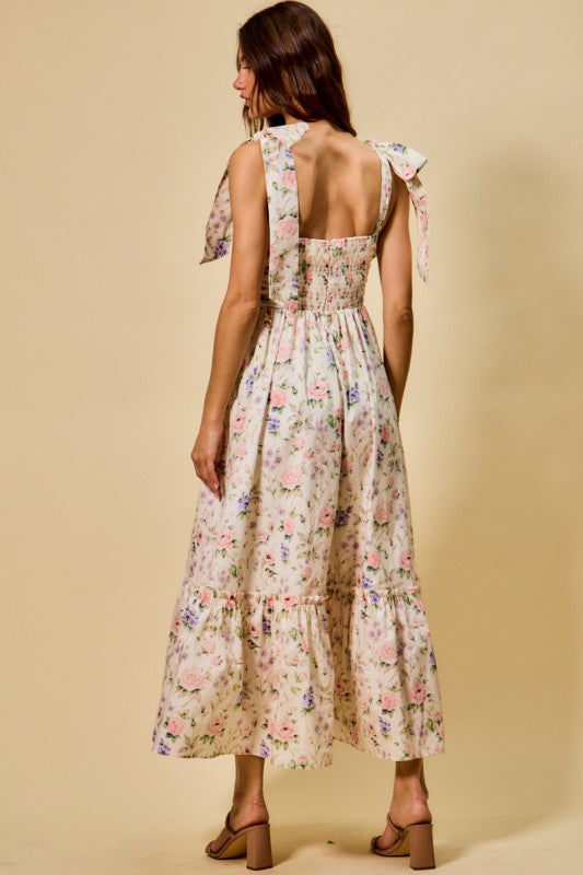 Vestido midi de algodón con corpiño fruncido, estampado floral, con lazo en la parte delantera y forro.