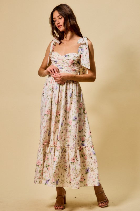 Vestido midi de algodón con corpiño fruncido, estampado floral, con lazo en la parte delantera y forro.