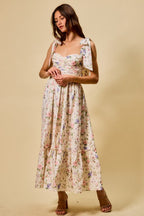 Vestido midi de algodón con corpiño fruncido, estampado floral, con lazo en la parte delantera y forro.