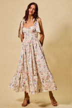 Vestido midi de algodón con corpiño fruncido, estampado floral, con lazo en la parte delantera y forro.