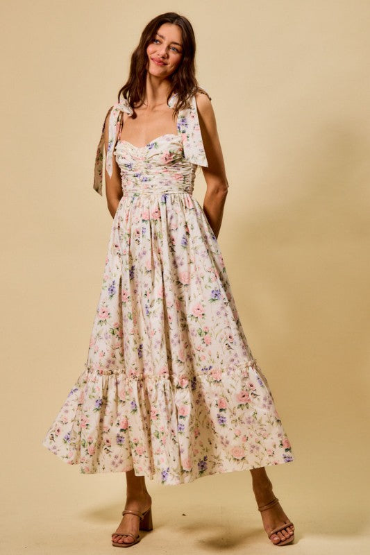 Vestido midi de algodón con corpiño fruncido, estampado floral, con lazo en la parte delantera y forro.