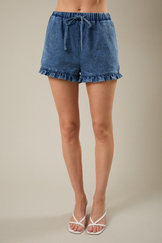 Bermudas de denim elásticos de tiro medio con dobladillo volante coqueto